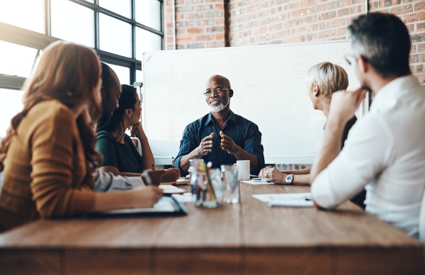 Cropped shot of a mature businessman leading a meeting in the boardroom